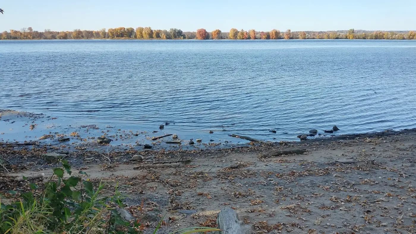 Ottawa River shoreline at Petrie Island with autumn trees opposite